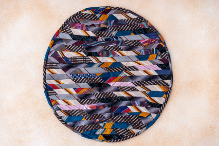 Patchwork rug. A fragment of colorful pieces of fabric sewn together.