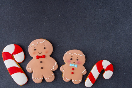 Gingerbread man cane icing. Food background. Christmas tree cookiesの写真素材