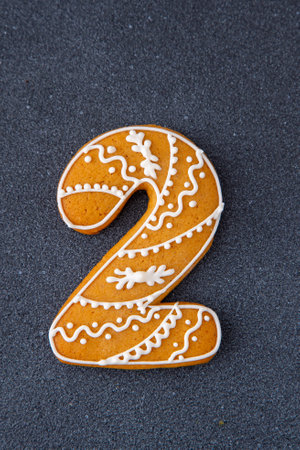 Decorated Gingerbread Cookie Number Two. Food background. Christmas decor.の写真素材