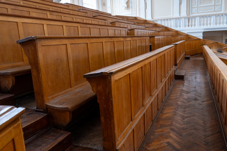 Rows of Wooden Benches in Lecture Hall. University auditorium classroomの写真素材