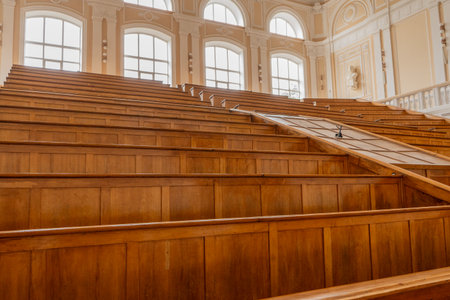 Interior View of Empty Lecture Hall with Tiered Seatingの写真素材