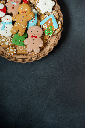 Gingerbread cookies with icing decoration. Christmas food. Gingerbread man baking. Top view table....