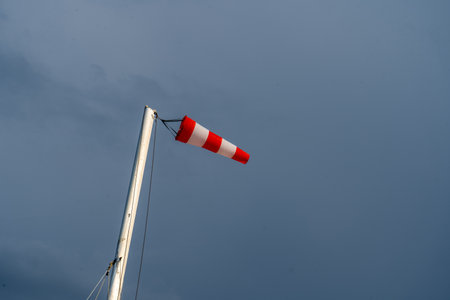 Windsock against rainy sky before thunderstormの写真素材