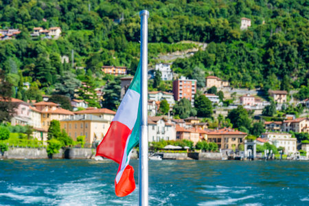 Italian National Flag Waving on Lake Como Italyの写真素材
