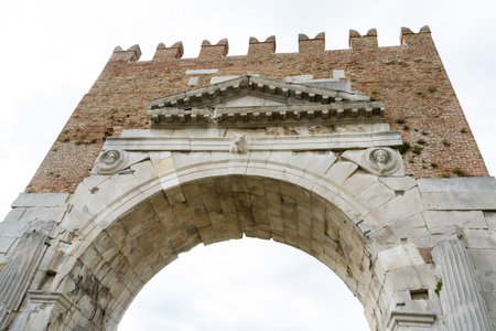 Triumphal Arch of Augustus. Rimini old Italian city center landmark. House square tower. Italyの写真素材