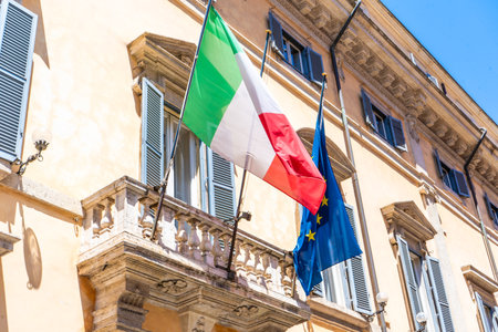 Flag of Italy and the European Union on the buildingの写真素材