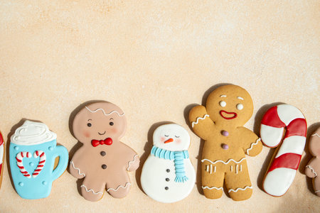 Gingerbread cookies with icing decoration. Christmas food. Gingerbread man snowman baking. Top view...