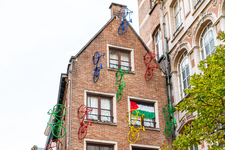 Brussels, Belgium street House with bicycles on the facade. Building old architecture in center cityのeditorial素材