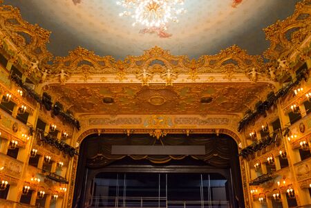 Editorial. May, 2019. Venice, Italy. Richly decorated auditorium of the theater La Fenice. Interior of the La Fenice Theatre.のeditorial素材