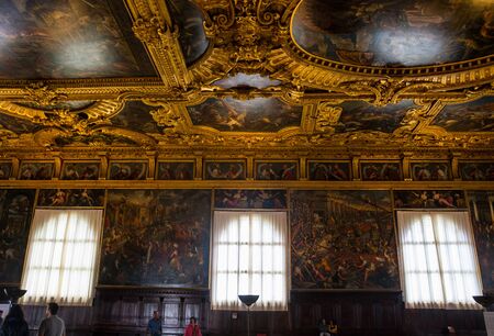 Editorial. May, 2019. Venice, Italy. Chamber of the Great Council - one of the richly decorated halls in the Palazzo Ducale. Portraits of Doge under the ceiling in the Chamber of the Great Council of the Doge's Palace (Palazzo Ducale)のeditorial素材