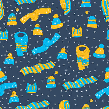 Winter seamless pattern with winter accessories: hats and scarves on blue background. Cute vector winter warm knitted clothes in cartoon style. Christmas vector illustration. Holiday designのイラスト素材