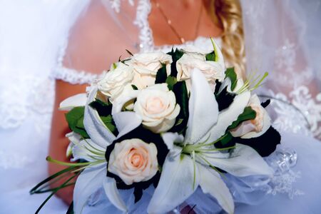 Bride holding bridal bouquet close upの写真素材