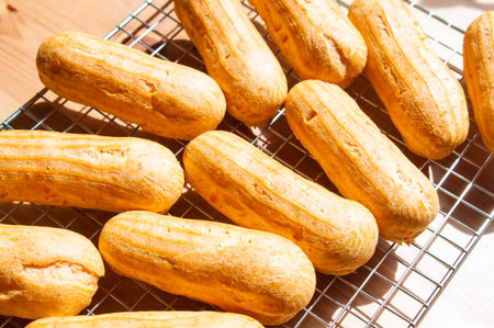 Freshly backed homemade eclair shells waiting to be filled with cream.