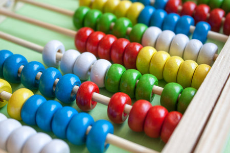 Colorful wooden abacus calculator background. Back to school concept.