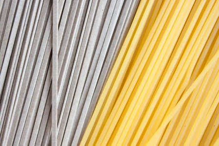 Classic Italian spaghetti and asian soba on kraft paper background. Food concept.の写真素材