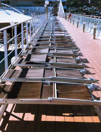 Deck chairs line on cruise ship. Vacation concept.の写真素材