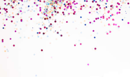 White, pink, magenta confetti sparkles festive background. Flat lay concept.の写真素材