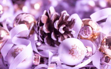 Christmas decorations and ornaments background in neon lilac purple tones. Christmas mood concept.の写真素材
