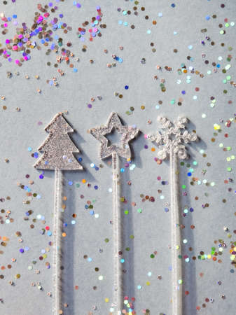 Silver and colorful Christmas decorations on pastel gray background. Flat lay style. Holiday classic concept.の写真素材
