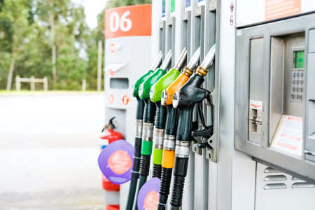 Colorful pump nozzles and gas station background. Lifestyle concept.の写真素材