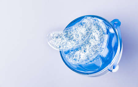Silver glitter reusable cooling under eye pads. Cosmetic products concept. の写真素材