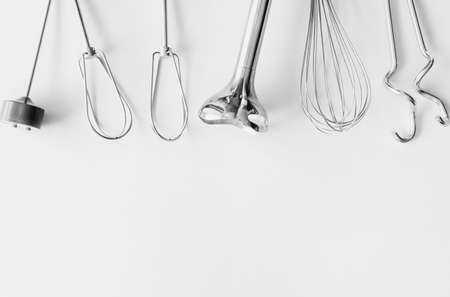 Baking tools, flour, different metal mixer whiskers black and white background.の写真素材