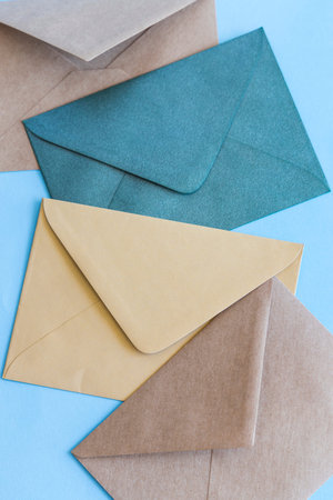 Colorful envelopes on blue background.の写真素材