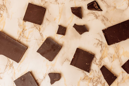 dark chocolate without sugar and gluten free for diabetics and allergics. Pieces of chocolate lie on...