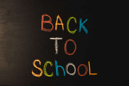 Back to school, the concept of parenting. The inscription on the blackboard colored chalk.の写真素材
