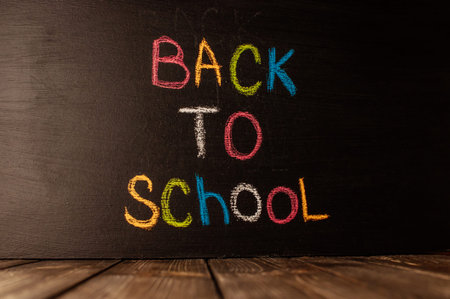 Back to school, the concept of parenting. The inscription on the blackboard colored chalk.の写真素材