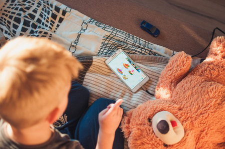 LOS ANGELES, CA, USA - OCTOBER 1, 2018: A phone with an educational game for a 5 year old child lies...