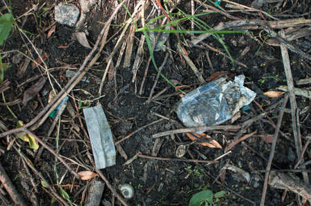 plastic waste, glass, ceramics and rubbish in the forest. Environmental pollution. Environmental issue and disaster. Go Green, Zero Waste, Save the Planet, Earth Day, No Plastic, Recycling Conceptの写真素材