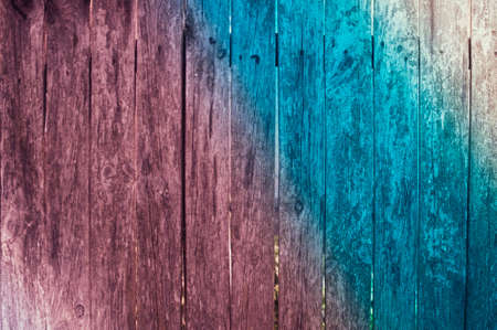 Barn wood planks with scratches and knots. Aged rustic style background with color tinting. Trend colored glare. Copy space. Layout for design.の写真素材