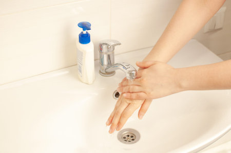 Step 2. Wet or rinse your hands with warm water before applying soap.