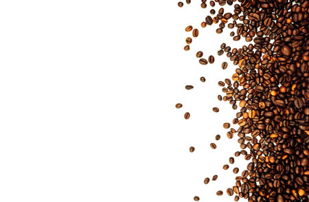 coffee beans scattered on a white background. aromatic arabica on a background with copy space....
