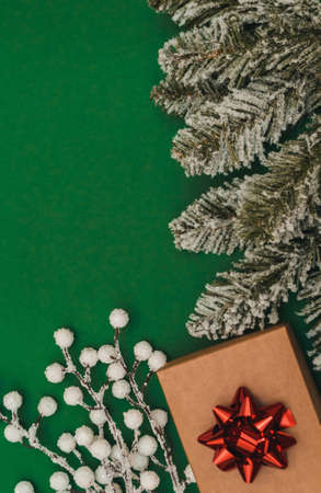 Christmas composition. Christmas gift, pine cones, thuja branches and gypsophila flowers. Flat lay, top view, copy spaceの写真素材