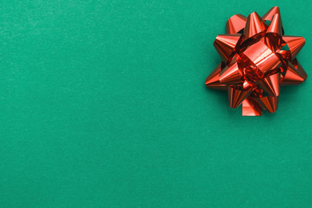 Happy new year greeting card. Christmas border with a red bow on a green background. Winter...