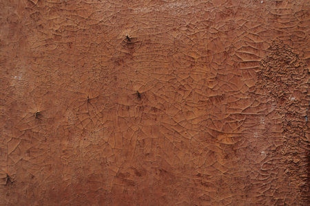 Multicolored background: rusty metal surface with peeling and cracking brown paint Natural defects...