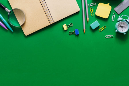 Welcome to school. Office supplies on a green school board. Various school supplies on a shabby...