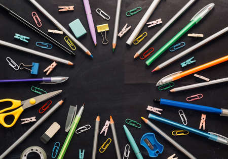 black graphite board with space for text and stationery. Concept for back to school or school sale. copy spaceの写真素材