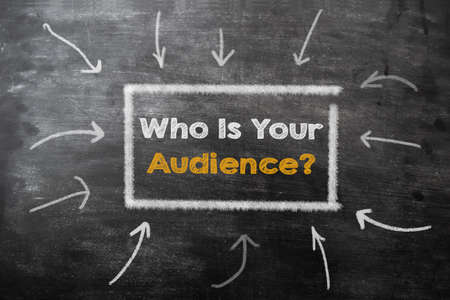 Who is your audience written on black chalkboard with chalk. Marketing conceptの写真素材