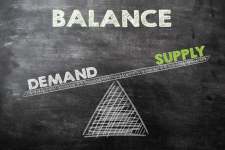 demand exceeds supply.graph drawing on chalkboardの写真素材