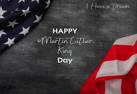 Happy Martin Luther King Jr. Day - I have a dream text in chalk on a blackboard. american flag on chalkboard.の写真素材