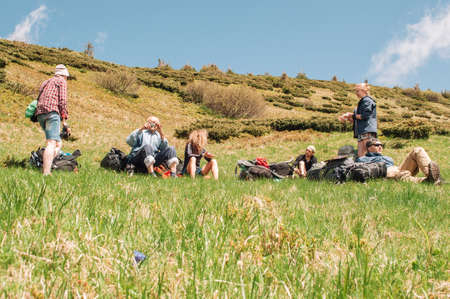 Goverla, Ukraine. 6, 2015 A large group of friends of tourists arranged a ramp for rest before climbing to the top. Travel concept with friends.のeditorial素材