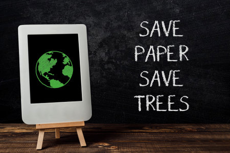 text Save paper, Save trees on black backgroundの写真素材
