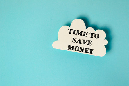 A white cloud with the words time to save money written on itの写真素材