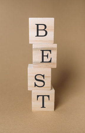 The blocks are arranged in a way that they spell out the word best. Concept of achievement and successの写真素材