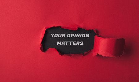 Red background with a black hole in it and the words your opinion matters written in whiteの写真素材