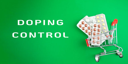 A cart full of pills is on a green background with the words written below itの写真素材