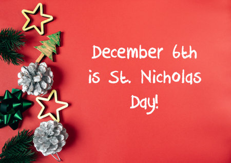 Red background with a Christmas tree and pine cones. The text reads December 6th is St. Nicholas Dayの写真素材